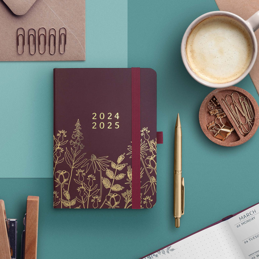 A bag-sized academic weekly planner with a purple and gold floral design