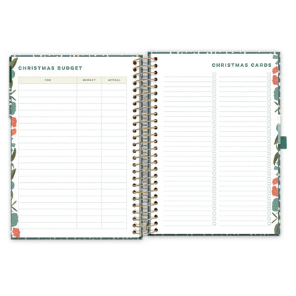 An open diary planner page with a Christmas budget page and Christmas cards list
