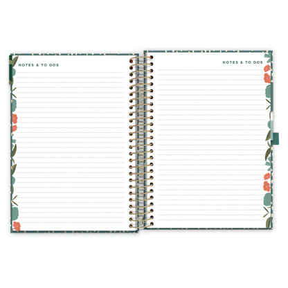 An open diary spread with floral pattern showing lined note pages