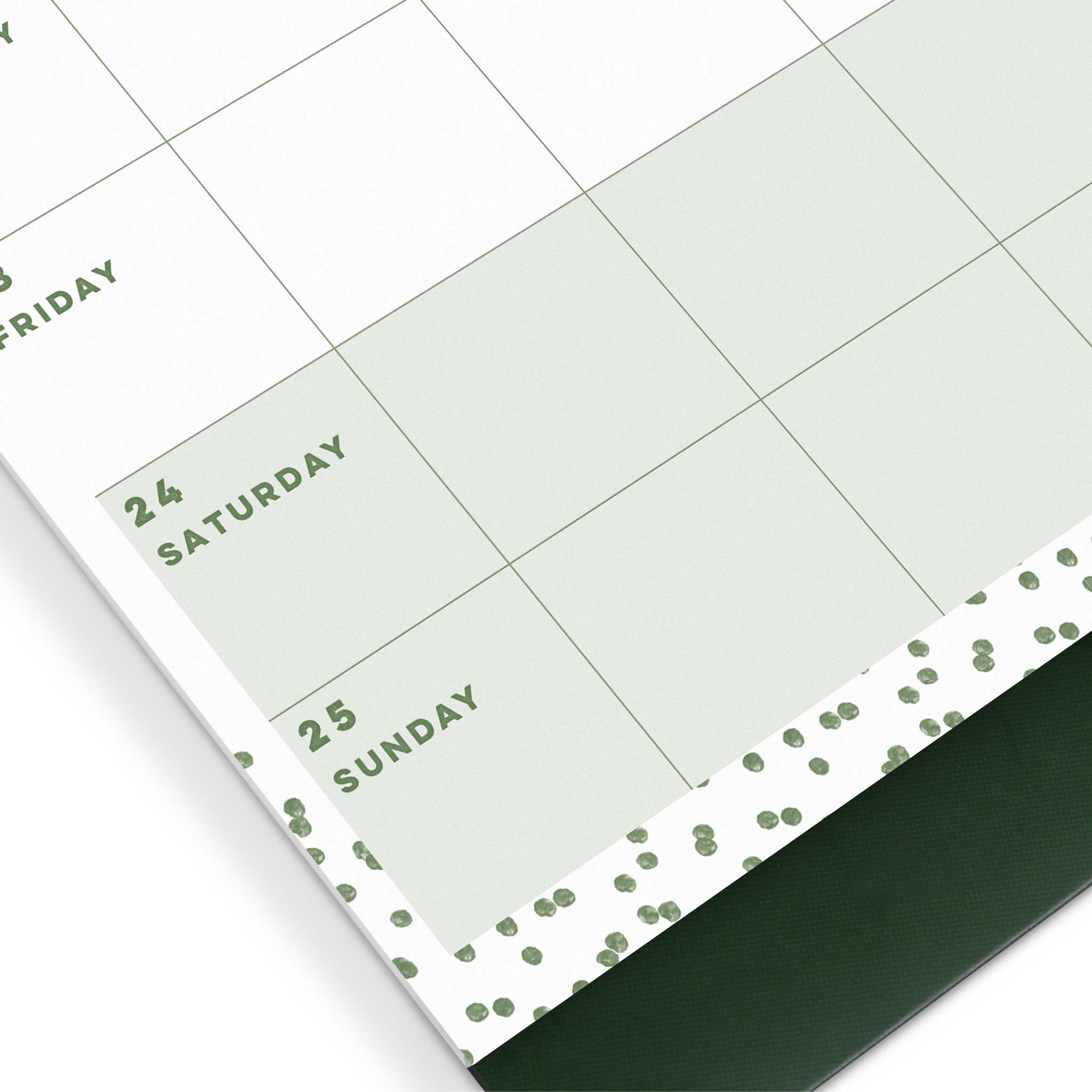 A close up of a calendar page showing shaded weekends