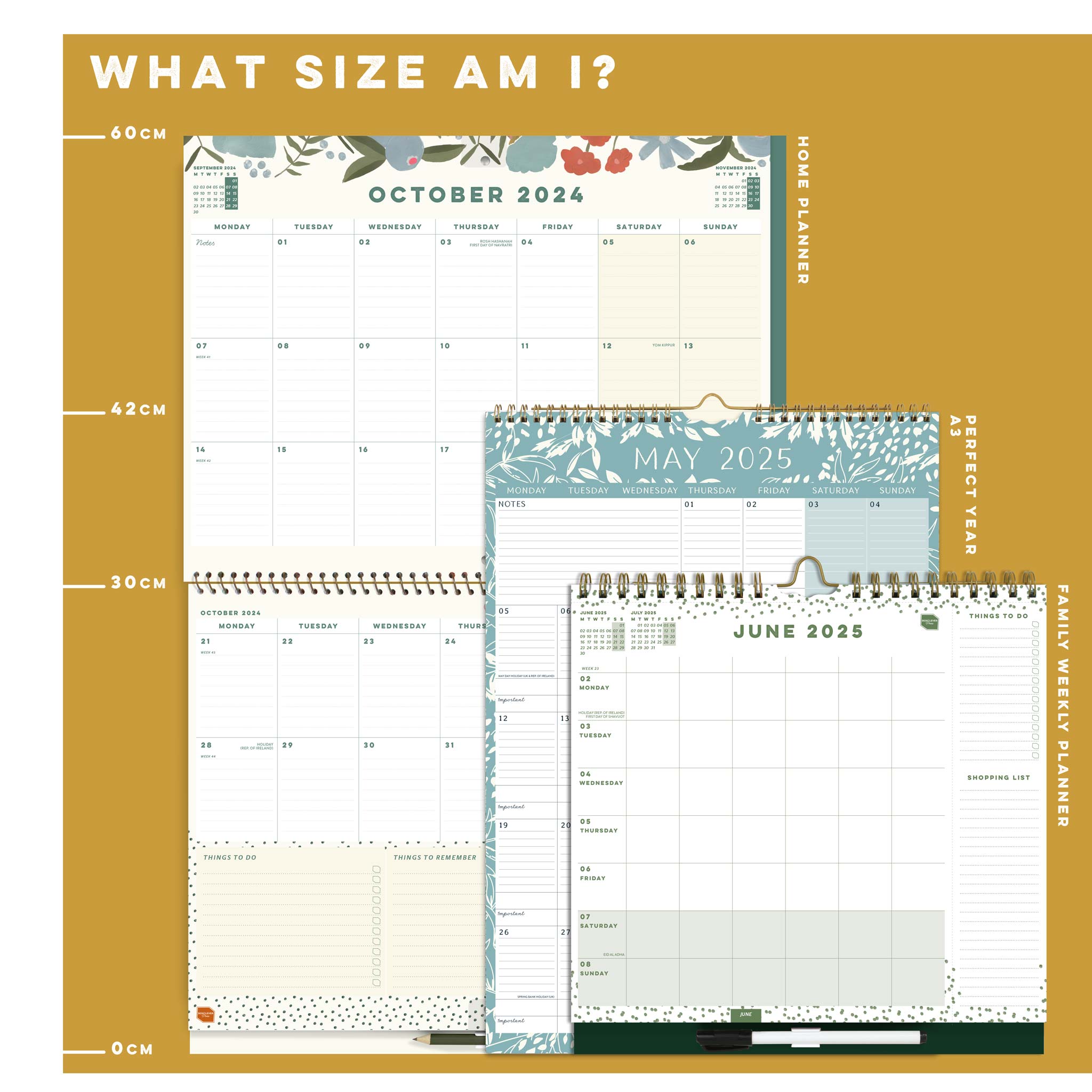 Three different sized wall calendars against a ruler