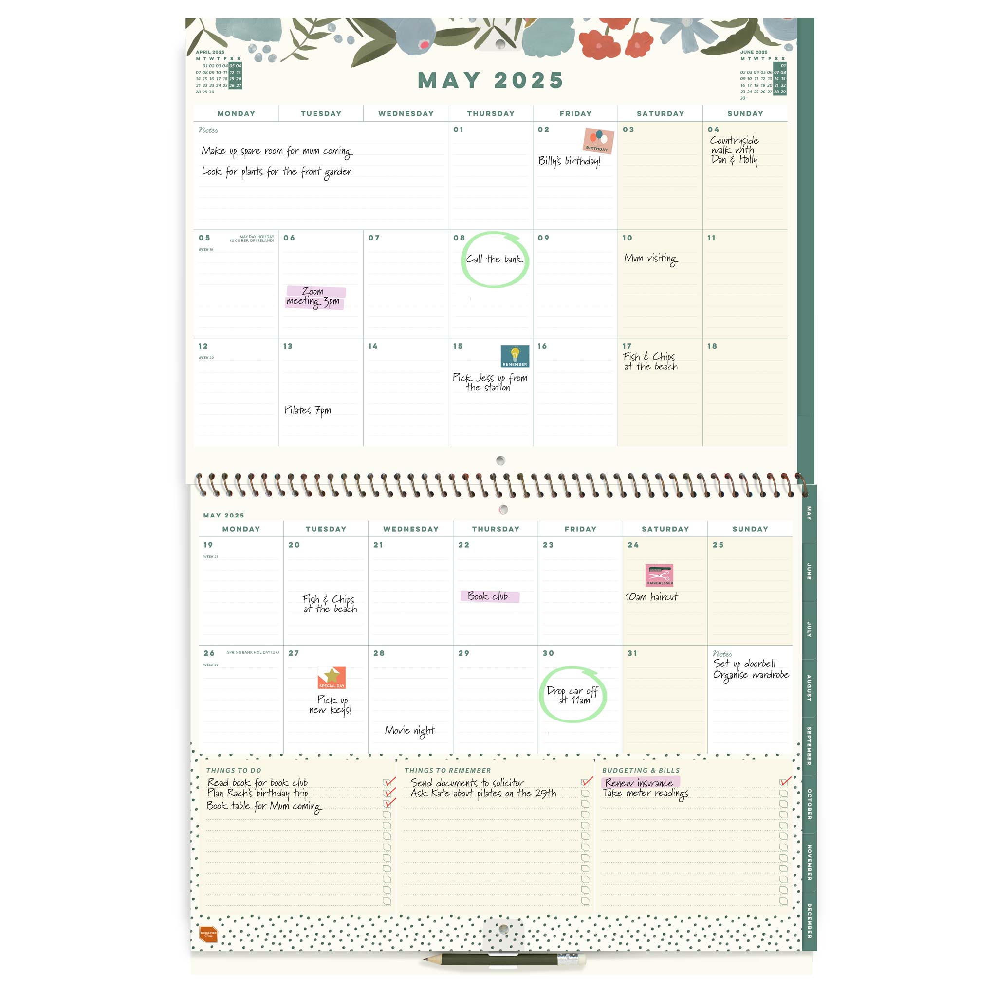 Open page spread of a large wall calendar, showing May 2025 with writing and stickers on it