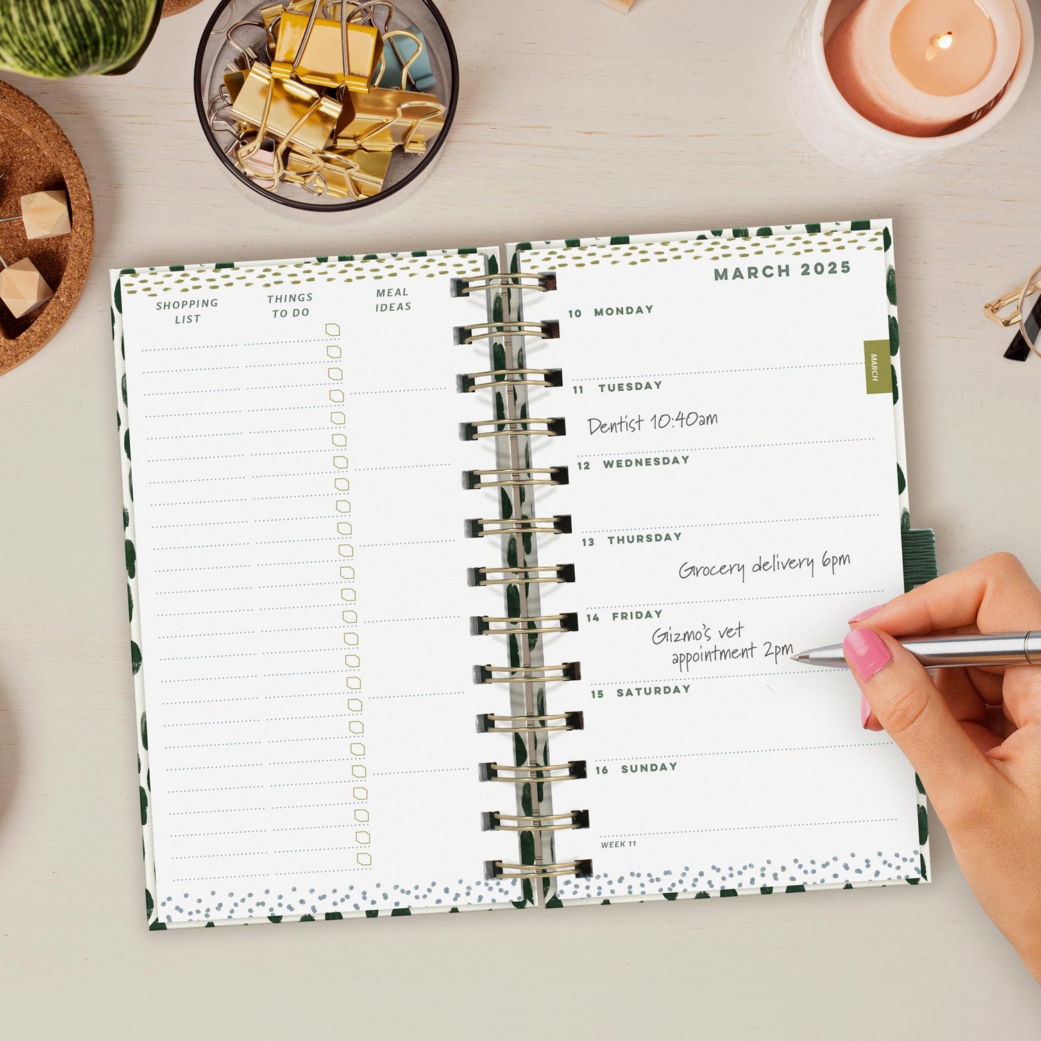 Open pocket diary on a week to view page with appointments being written in.