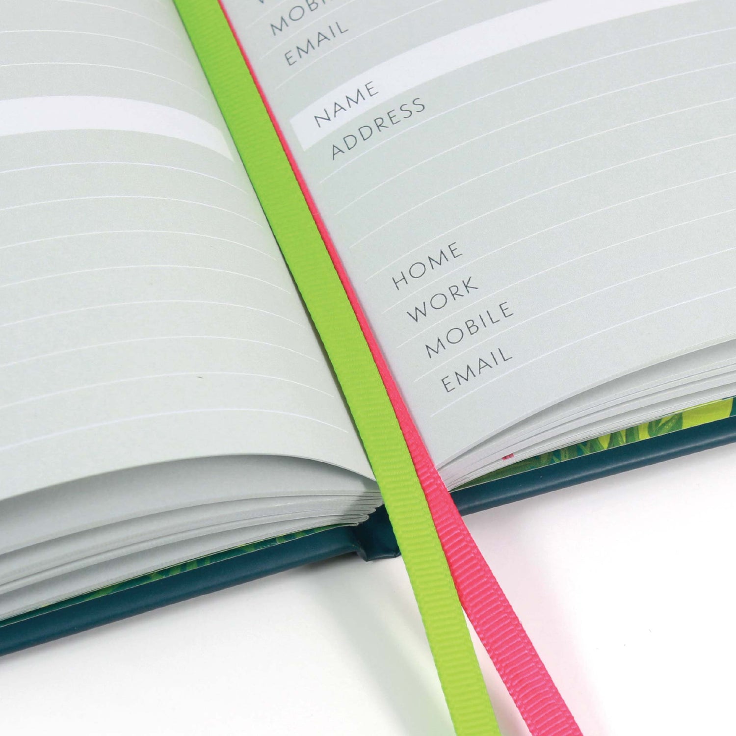Large address books with ribbon page markers.