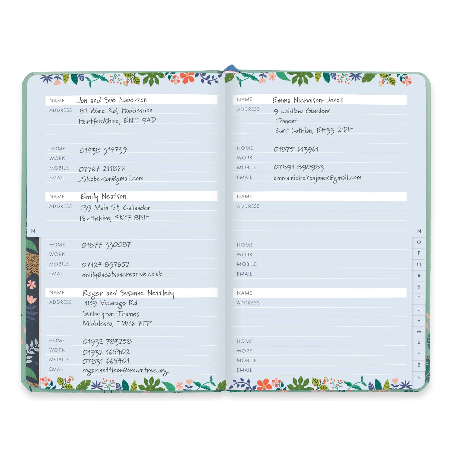 A small address book open to show 3 name and address spaces per page.
