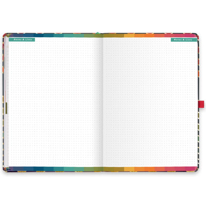 An open diary with dotted notes and lists pages.