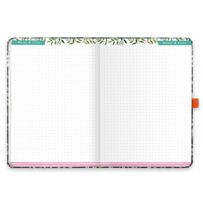 An open diary with dotted notes and lists pages.