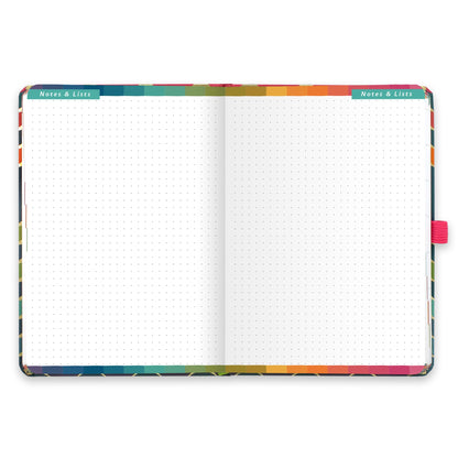 An open diary with dotted notes and lists pages.