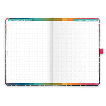 An open diary with dotted Christmas notes and plans pages.
