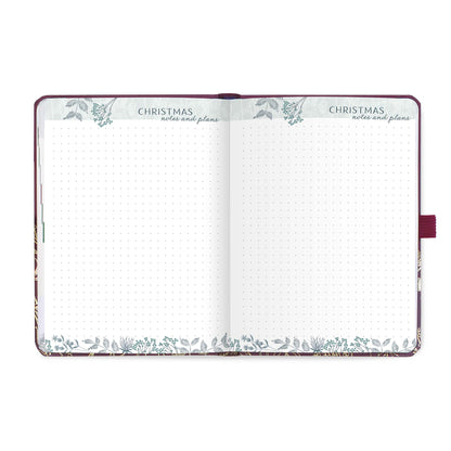 An open diary with dotted Christmas notes and plans pages