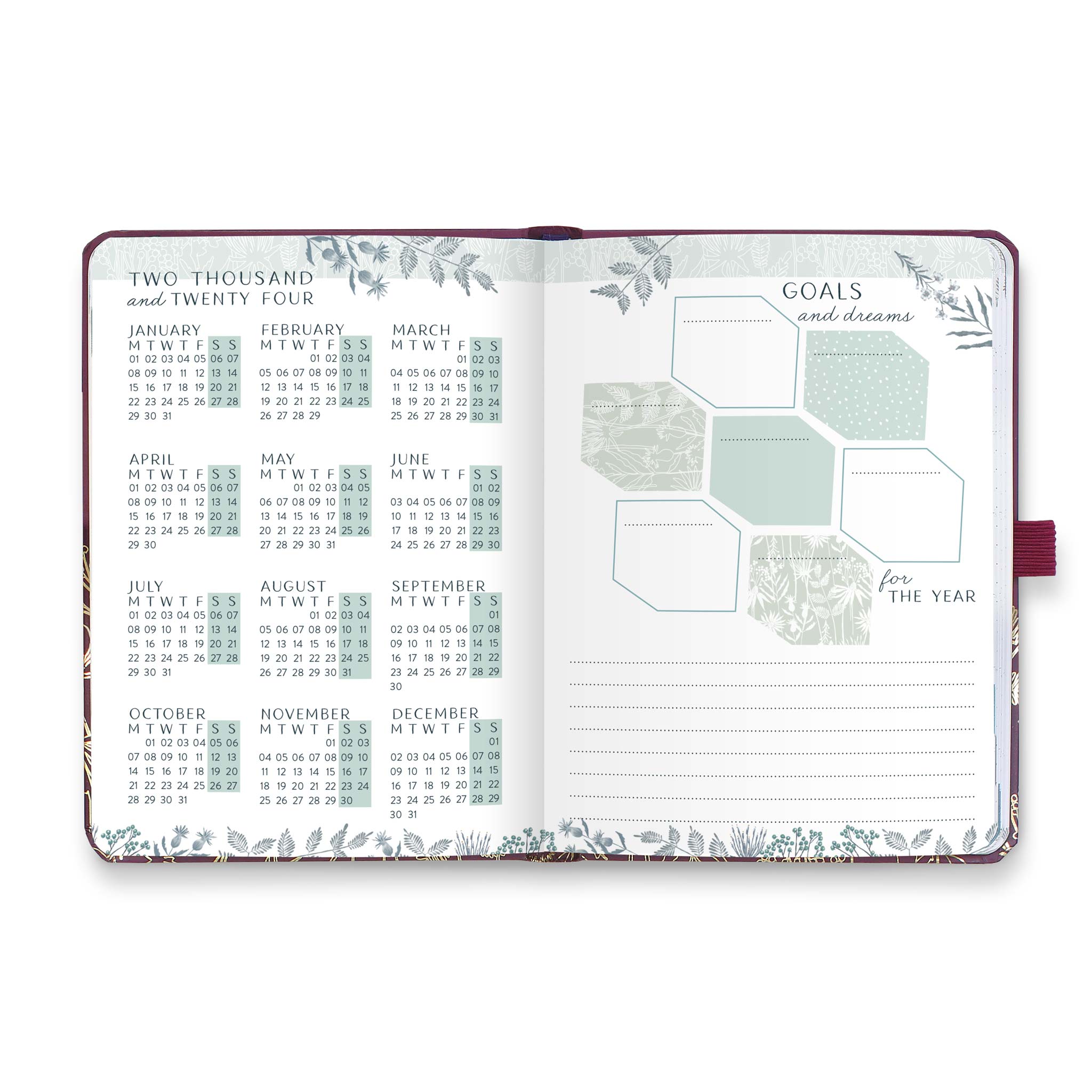 An open diary planner with a goals and dreams for the year page and a page with year microcalendars for 2024 and 2024