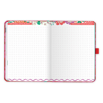 An open diary with dotted Christmas notes and plans pages.
