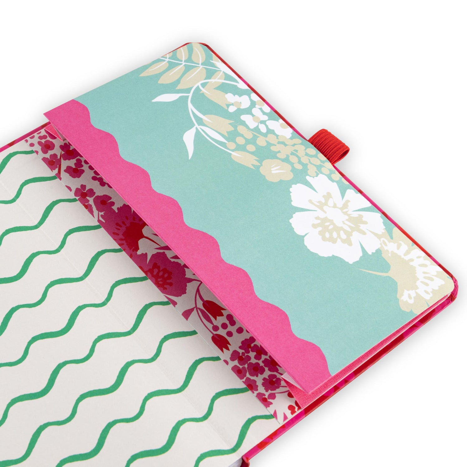 Diary back pocket with a floral leaf design and red pen loop.