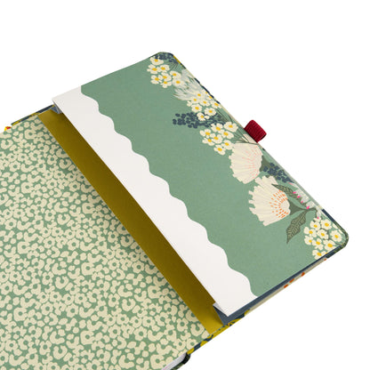 A back diary pocket with floral design and a dark red pen loop.