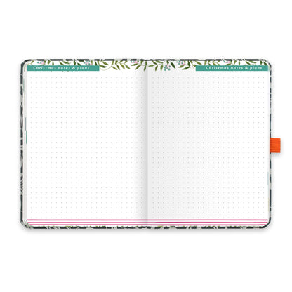 An open diary with dotted Christmas notes and plans pages.
