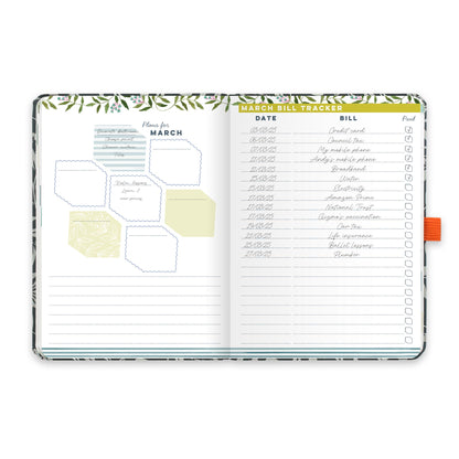 An open diary planner with a monthly plans page and a monthly bill tracker.
