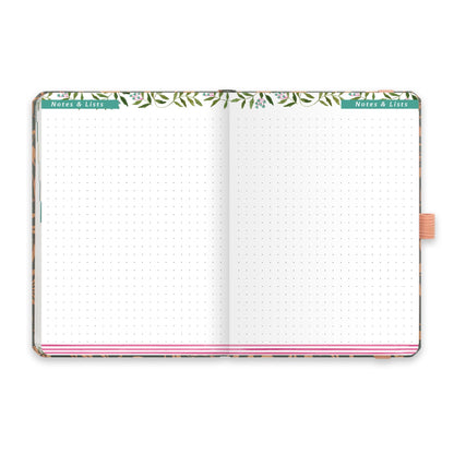 An open diary with dotted notes and lists pages.