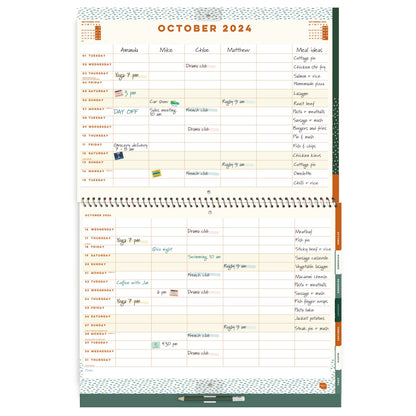 Open page spread of a large wall calendar, with 6 columns and writing on it