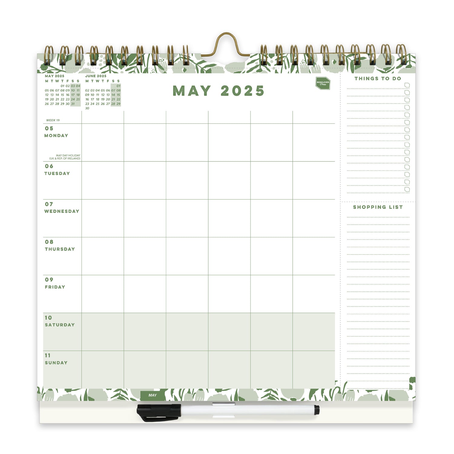 A wall calendar page with a 6 column weekly layout, lists and a clip on pen.