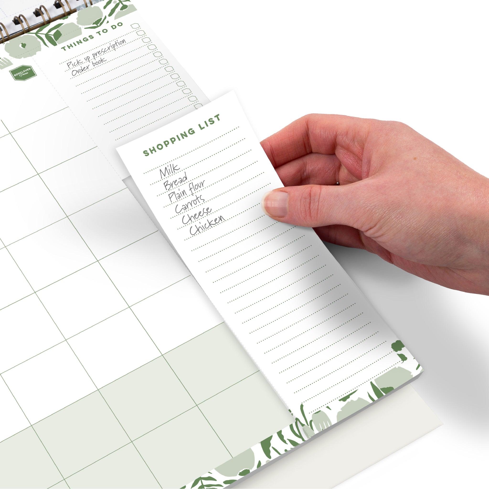 A calendar page with a things to do list and a perforated shopping list.