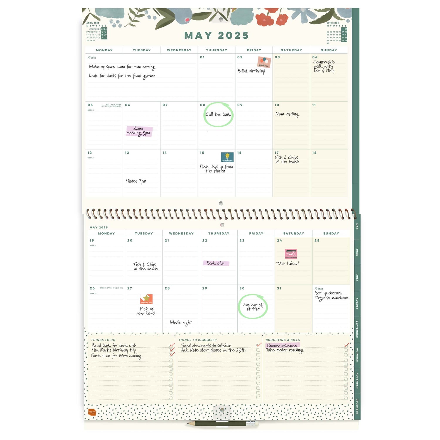 Open page spread of a large wall calendar, showing May 2025 with writing and stickers on it