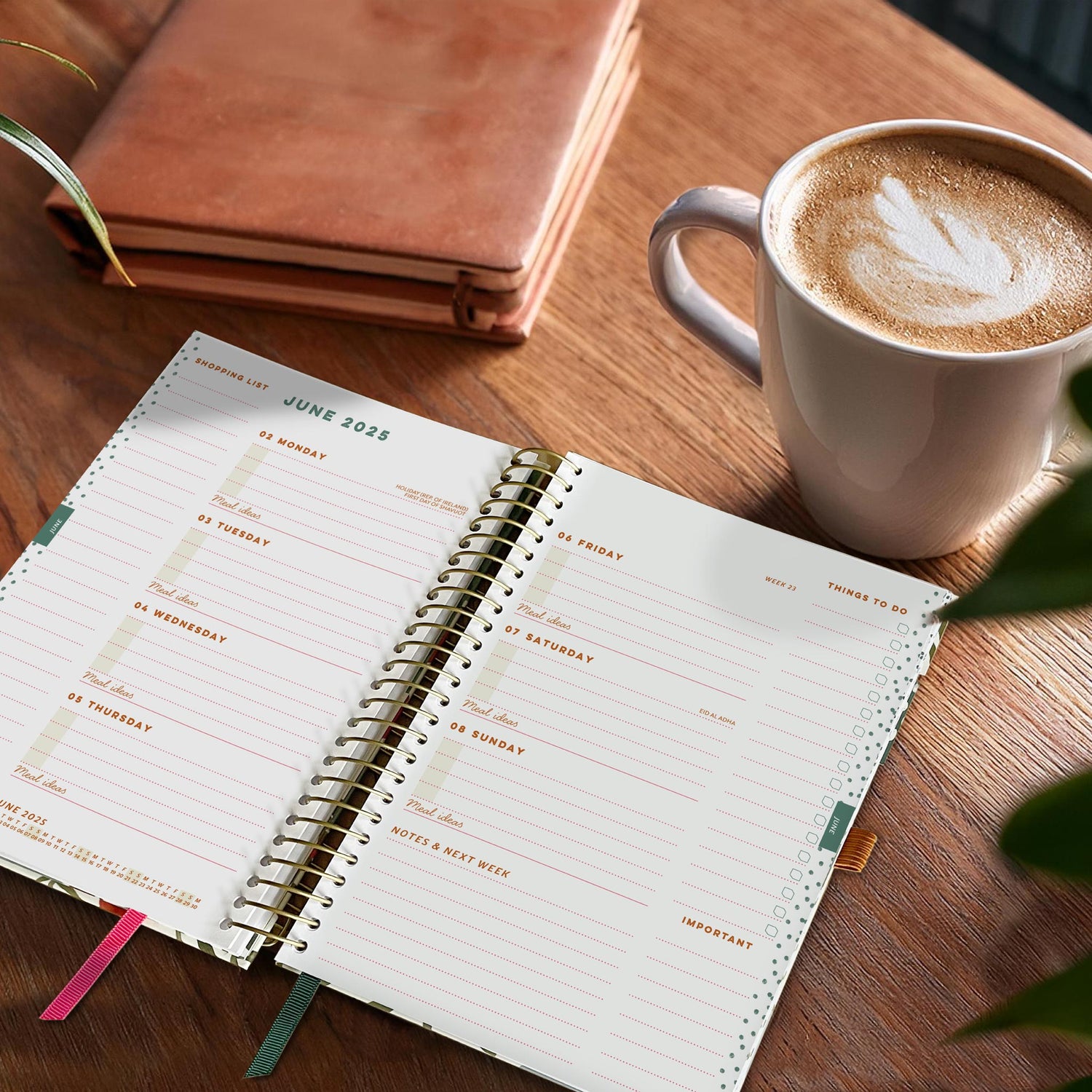 Open Life Book Diary on a wooden table next to a Cappuccino. 